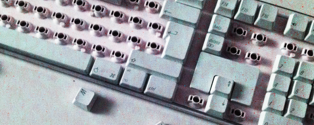 a broken keyboard with keys out of place